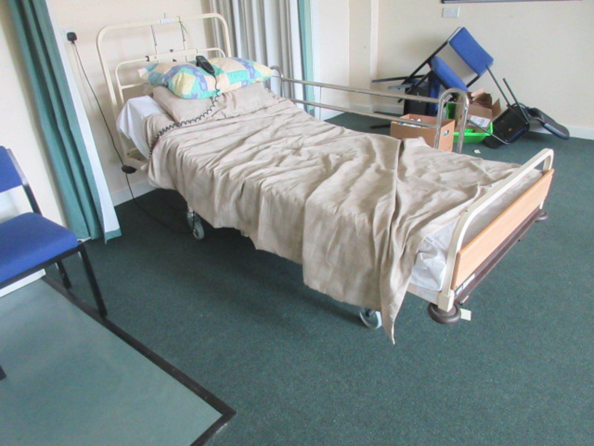 Huntleigh Nesbit Evans medical bed with powered rise & fall, tilting back rest. Holehouse Road.