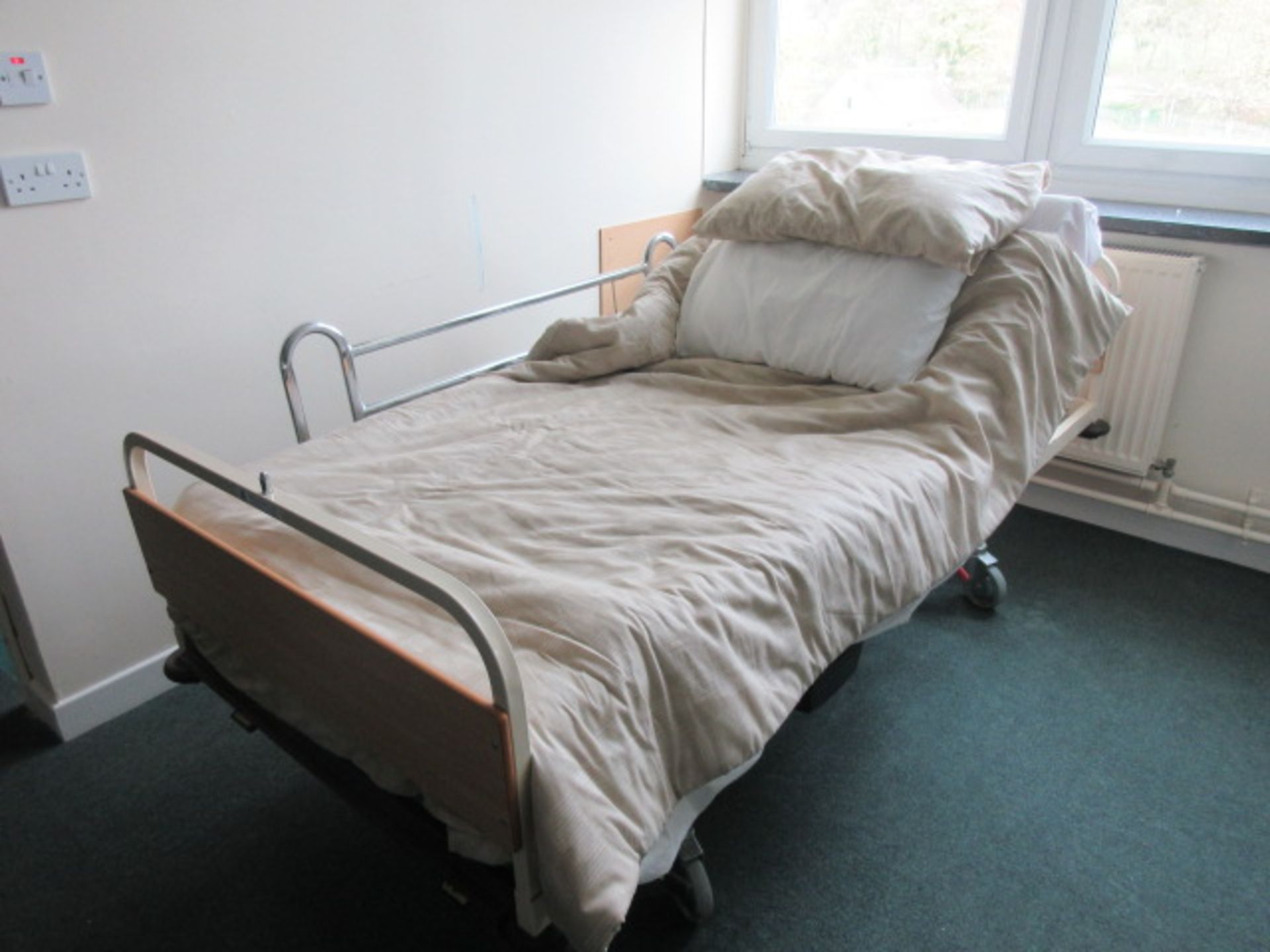 Huntleigh Nesbit Evans medical bed with powered rise & fall, tilting back rest. Holehouse Road.