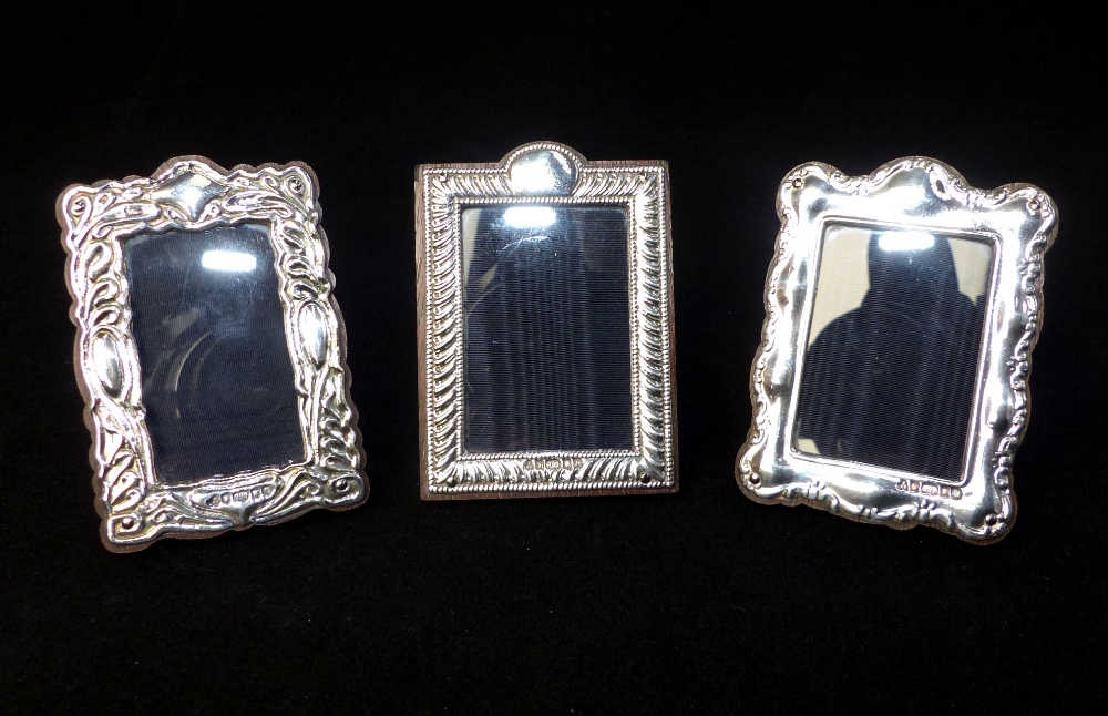 Three small Britannia silver photo frames, with gadrooned and foliate design,