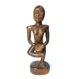 African carved wooden figure of a drummer,