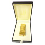 Dunhill Rollagas lighter, with a rectangular engine turned body,