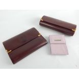 Cartier burgundy spectacles case and matching tri-fold ladies purse / credit card and bank note