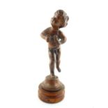 20th century bronzed metal figure of a putto emblematic of sculpture, on turned wood plinth,