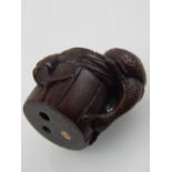 Japanese Meiji carved boxwood netsuke, modelled as snails upon a staved wood cup,