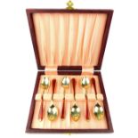 Cased set of Art Deco enamelled and silver gilt coffee spoons