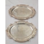 Graduated quartet of Elkington silver plate oval serving dishes with Rococo edges,