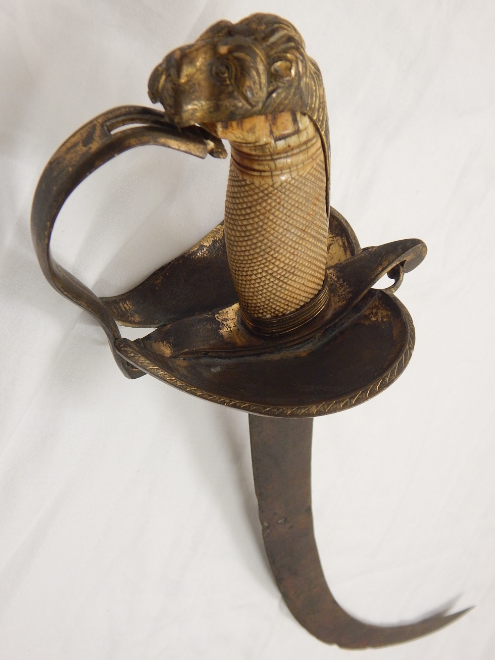 Late 18th Century early 19th Century Cavalry sword, brass iron pommel, carved ivory grip,