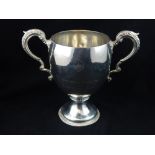 Early 19th C hallmarked silver twin-handled trophy cup, on circular foot,