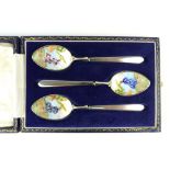 Cased set of three silver and enamelled tea spoons,