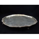 Victorian hallmarked silver circular tray, bead trim, ball and claw feet, 35cm dia.
