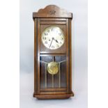 Continental walnut wall clock, eight day movement, the silvered dial with Arabic numerals,