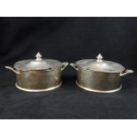 Unusual pair of hallmarked silver caviar containers with covers and liners, c.