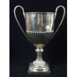 Good inverted campana form hallmarked silver trophy cup with twin loop handle on spreading post and