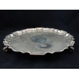 Late Victorian silver drinks tray, fluted rim, shell scroll feet, London 1900, horn motif to centre,