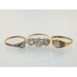 A 9ct gold and diamond ring sold together with two other 9ct gold and white stone rings.