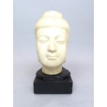 Sino Tibetan carved marble head of Buddha on associated ebonised wood plinth,