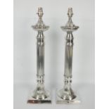 A pair of contemporary silver plated reeded column table lamps, 55cm.