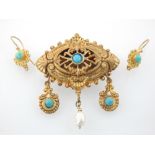 Gilt metal brooch, hollow pierced with a baroque pearl drop, with a pair of ear-drops,