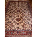 Tabriz style ivory ground carpet, the floral design field within a conforming border,