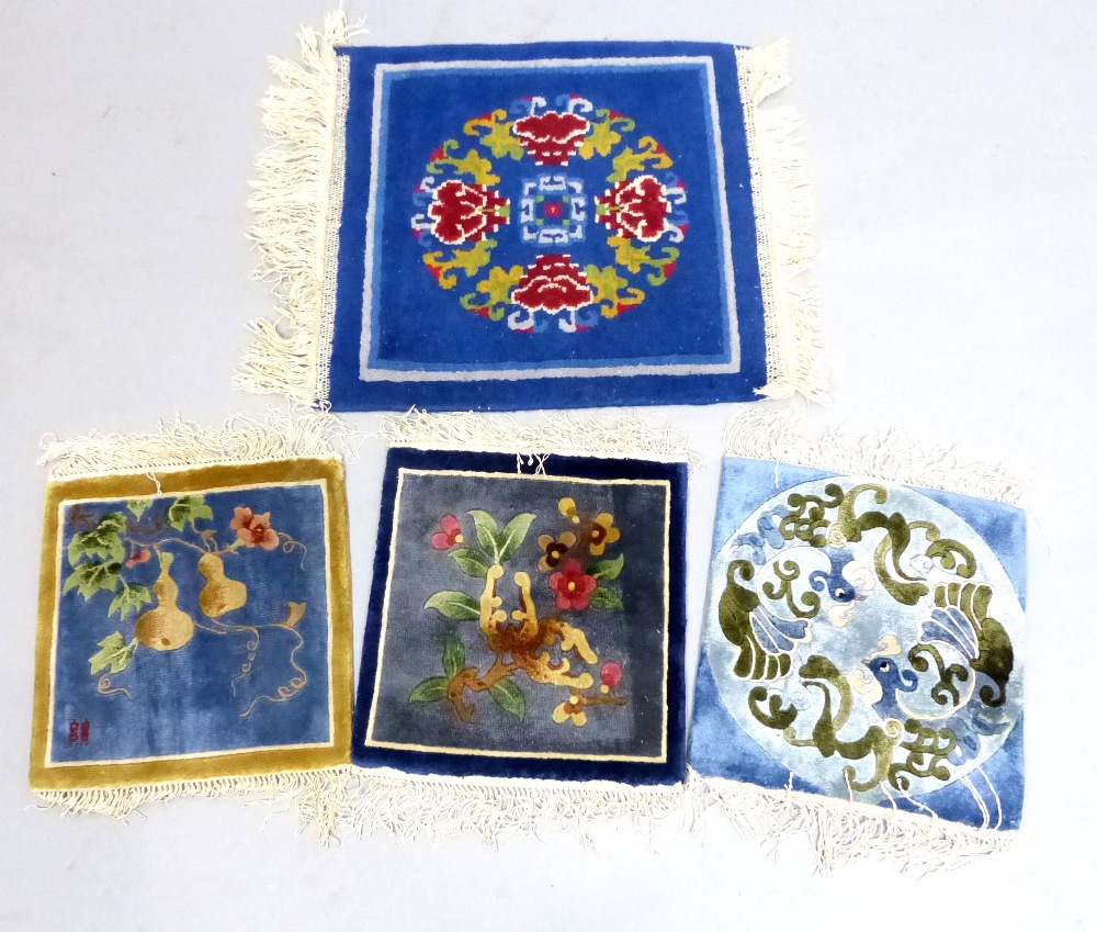 Three Chinese hand knotted silk miniature rugs, sold together with a Tibetan meditation rug,