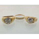 Three 9ct gold and white stone rings.