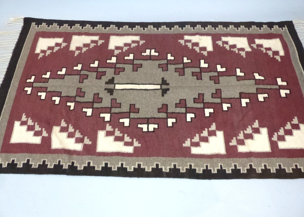 A large Tapete Navajo style rug woven by Edmondo Montano, circa 1985,