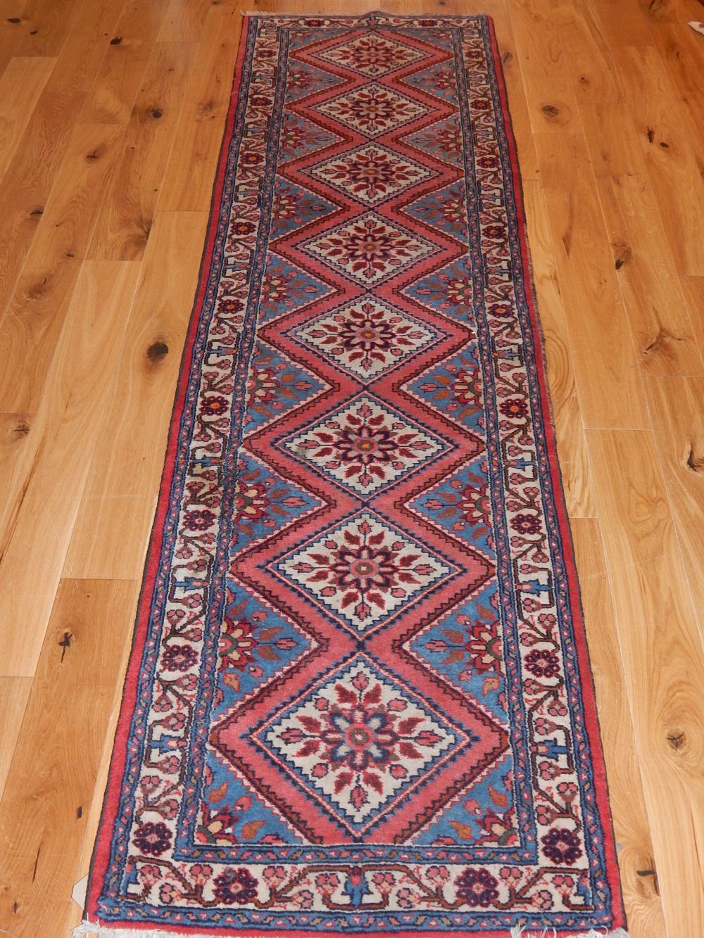 Hamadan runner, with stepped medallions and overall floral design, fringed,