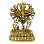 Sino Tibetan bronze of multi armed deity on oval cast lotus base, 23 cm H.