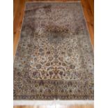 Kehan ivory ground rug, woven stylized flowerheads and leaves within a wide conforming border,