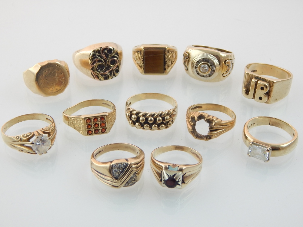 Twelve 9ct gold gentlemen's finger rings, some Edwardian, some with white stones,