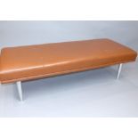 Contemporary Davison Highley tan leather long stool on four tapered alluminium feet, 160 cm L.