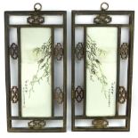 Pair of Chinese porcelain panels, organic design, within carved wooden frame, 46 x 24cm