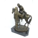 Patinated bronze group of an Arabian nobleman assisting a lady from a stallion on canted marble