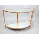 Contemporary gilt metal and clear glass D shaped console table with mirrored undertier, 128 cm W