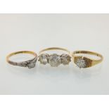 A 9ct gold and diamond ring sold together with two other 9ct gold and white stone rings. (3)