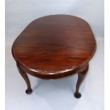 An Edwardian mahogany extending dining table, with D-shaped ends and raised on cabriole legs,