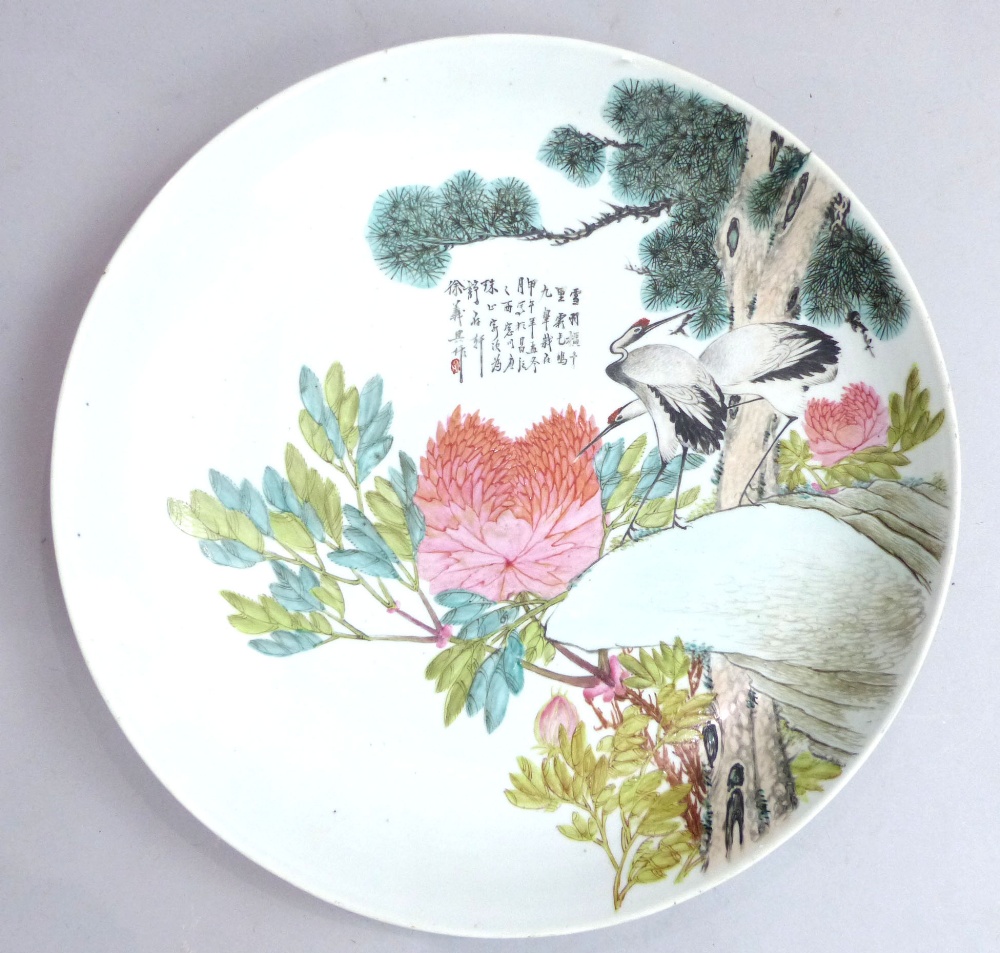 Chinese porcelain charger decorated with heron, blossom and verse.