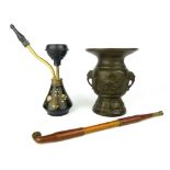 Chinese bronze opium pipe, a turned wood pipe and a small bronze vase decorated with birds among