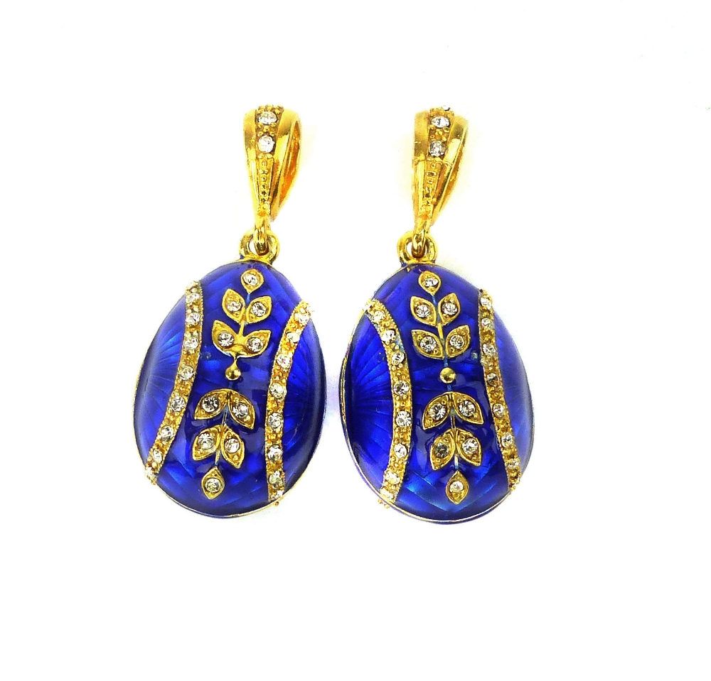 Pair of blue guilloche enamel egg pendants with floral decoration.