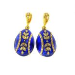 Pair of blue guilloche enamel egg pendants with floral decoration.