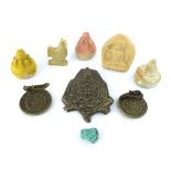 A selection of antique Asian artefacts comprising bronze zodiacal medallions, clay models of