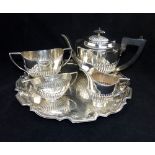 Silver plated four piece tea set, gadrooned design, and a silver pie crust bordered silver plated