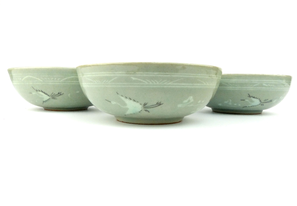 A set of four Korean porcelain footed bowls, the crackle celadon glazed bodies decorated with frieze - Image 2 of 4