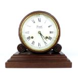 Comitti mantel clock, mahogany, brass movement.