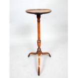 19th century mahogany wine table, the circular dish moulded top on a slender turned support and