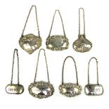 Silver clam shell Vodka decanter label, four Victorian style embossed silver decanter labels and two
