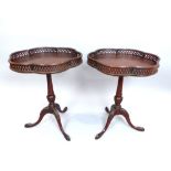 Pair of lamp/wine tables, pierced gallery, six 'petal' shape, tripod and pad feet, label for