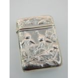 Small rectangular vesta case, with foliate repousse decoration, stamped sterling, 5cm