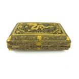An antique Sino-Tibetan white metal and gilt box, the hinged lid decorated with a dragon, 14 x 9 x