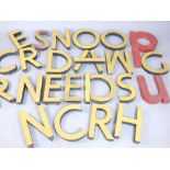 Collection of 26 yellow and red painted metal building signage lettering, circa 1960,